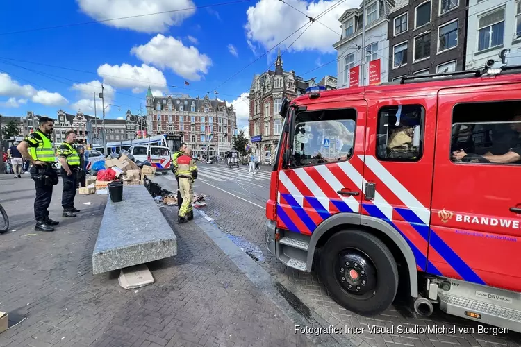 Tramverkeer Muntplein tijdelijk stilgelegd vanwege containerbrand